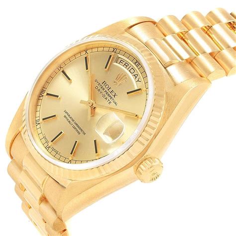 18 karat gold rolex watch.